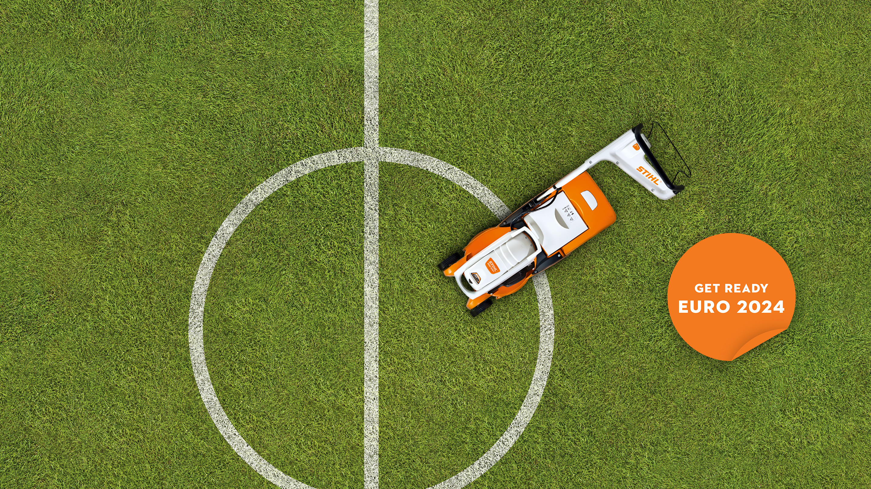 Soccer lawn with a STIHL RMA 339 C lawn mower and a “Get ready: EURO 2024” badge